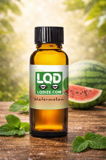 Bottle of LQD watermelon liquidizer for concentrate to vape oil flavor oil with watermelons and mint leaves on a wooden surface.